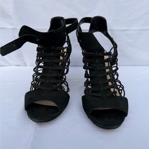 A lightly used pair of black Vince Camuto Sandals
